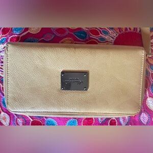 Pale yellow leather Kenneth Cole zippy wallet. Apx 8 x 4.5“. GUC